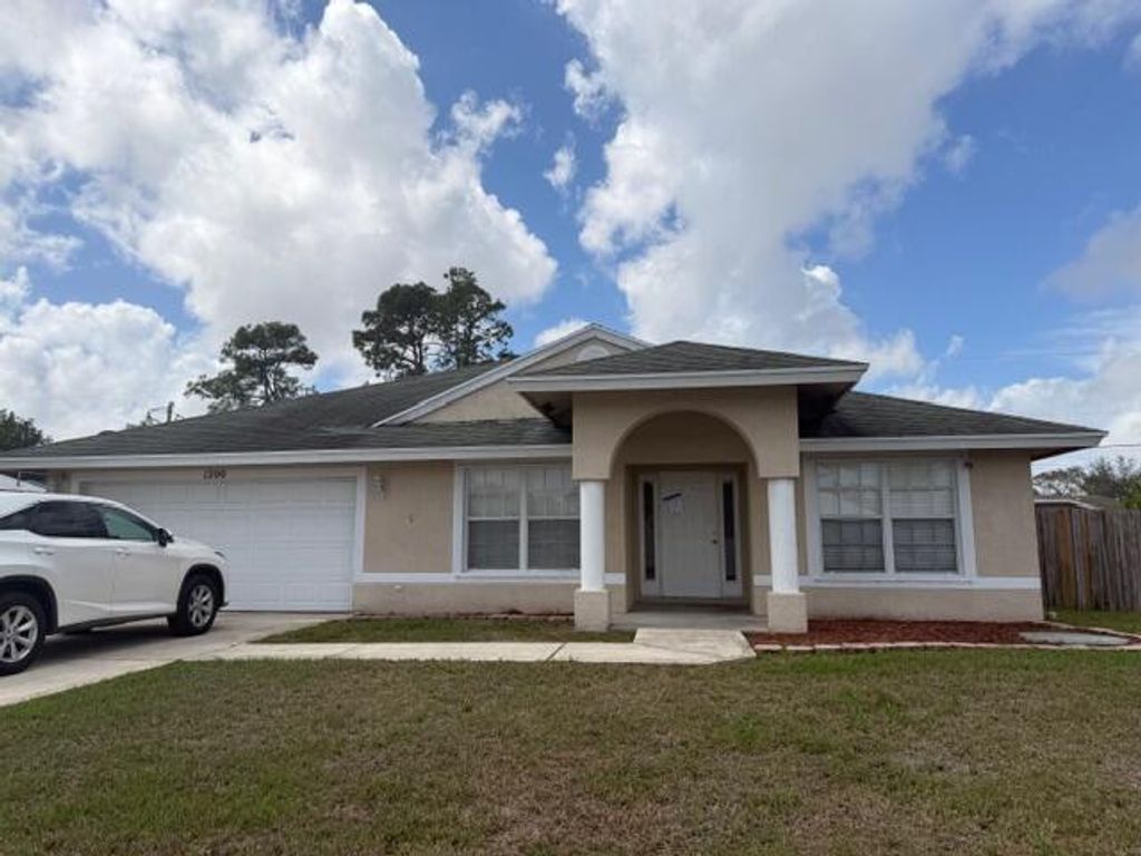 Photo of 1200 SE Ladner Street, Port Saint Lucie, FL 34983 (MLS # B26000176)