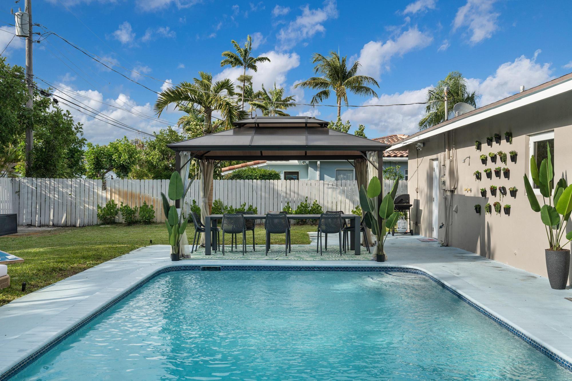 This bright turnkey private pool home is located in the prestigious Coral Ridge neighborhood. Close to Lauderdale by The Sea Beach, golf, restaurants, and shopping. The one-story home features a split open-concept design creating a seamless flow between the living room, dining room, and kitchen overlooking the oversized pool surrounded by tropical landscaping. Recently remodeled. 4 spacious bedrooms, 2 bathrooms plus an additional den/office area. Many features include impact windows & doors, newer appliances, 2016 water heater, irrigation system, recessed lighting & a huge circular driveway. No HOA fees. Don't miss out on the best-priced home in Coral Ridge! Contact us today to schedule your private showing and experience the lifestyle you've been dreaming of. Rented Furnished.