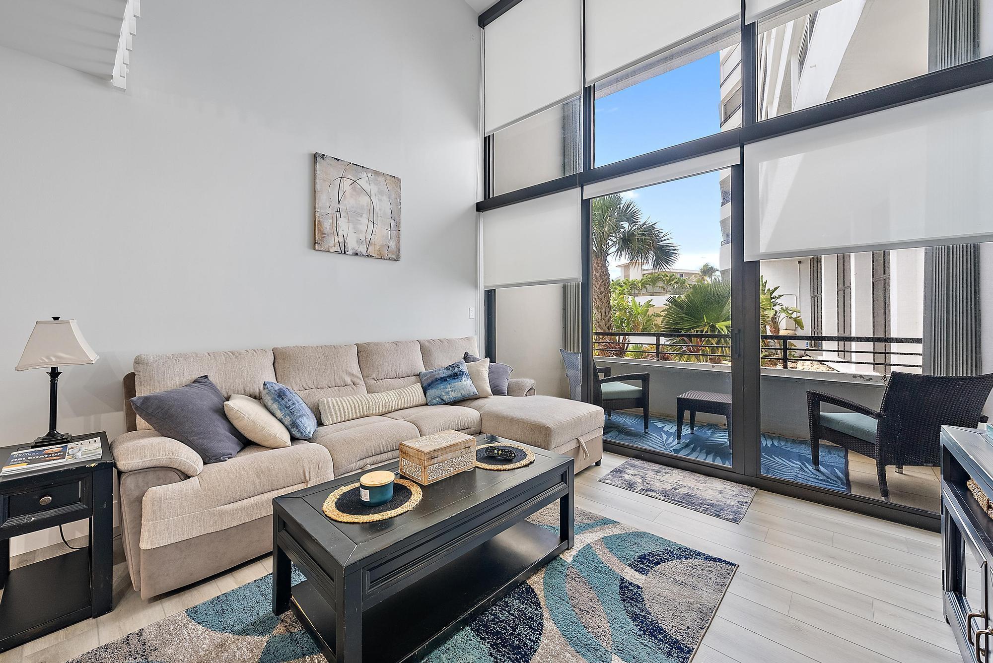 Enjoy the ocean breeze from this beautifully updated loft-style condo in South Palm Beach, where stunning floor-to-ceiling windows frame peaceful views of the community garden and fill the home with natural light. This unique residence combines modern updates with a relaxed coastal lifestyle, creating the perfect retreat for year-round living or a vacation escape.The community offers an array of resort-style amenities designed for both relaxation and recreation. Residents enjoy deeded ocean access, two heated pools, a sauna, a fitness center, and a beachside sundeck with a gazebo and BBQ area, perfect for entertaining or simply soaking up the Florida sunshine.