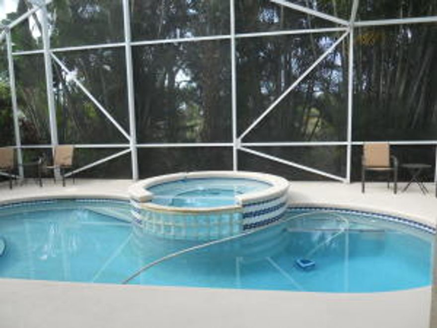 Look at this beautiful 4 bedroom 2 bath, solar pool home spacious open concept with soaring ceilings. Pride of ownership is evident in this immaculate home. Enjoy sunsets from the large screened pool area. Soak away the day in the 6 person remote controlled hot tub in this very private location on preserve which is home to many tropical birds. The master suite opens up to pool area. Master bath has a huge soaking tub and separate shower. can close before school starts if needed. The kitchen, dining room and living room are open concept that looks out to pool area for a very beautiful entertaining area. Accordion Shutters. AC has always had yearly maintenance checks.