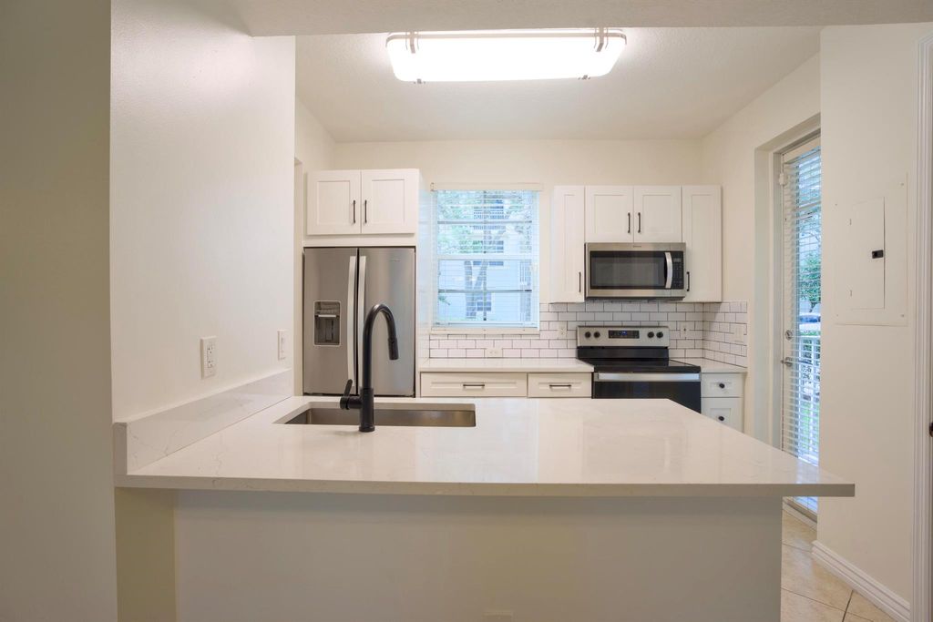 Photo of 4903 Chancellor Drive #10, Jupiter, FL 33458 (MLS # R11124191)