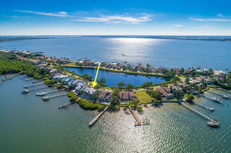 Waterfront living at its finest! Discover Joe's Point, a secure gated community on Hutchinson Island with only 49 residences situated on a private peninsula. This 4-bed/4-bath contemporary bi-level pool home offers expansive upper and lower-level living areas to accommodate your family and home office needs. Recently updated, the home features a new kitchen with a gas stove, cooktop, double wall ovens, two dishwashers, and more. Enjoy wide water views or fish from your own dock complete with utilities and a 16,000 LB lift) that accommodates a 32' boat. Neighborhood amenities include a gated entrance with a winding landscaped drive, tennis, R/V and boat storage, community dock, and private beach with gated access.