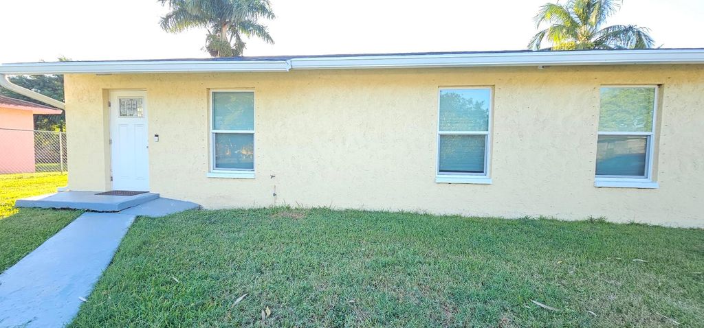 Photo of 323 Seminole Court, Pahokee, FL 33476 (MLS # R11157065)