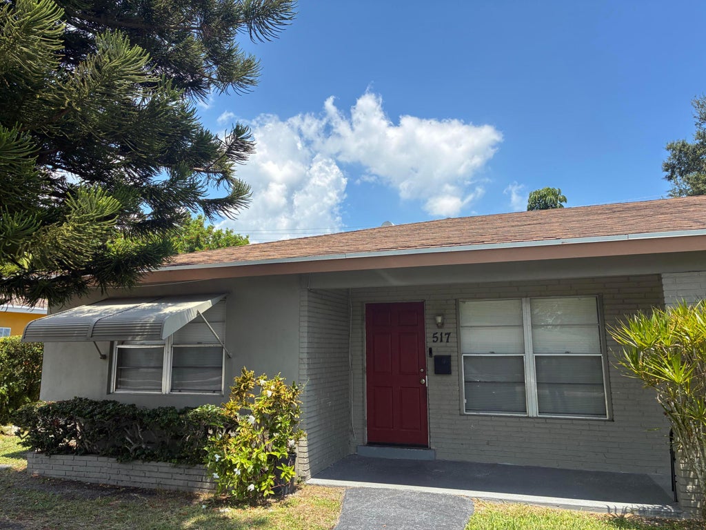 Photo of 517 Silver Beach Road, Lake Park, FL 33403 (MLS # B26071102)