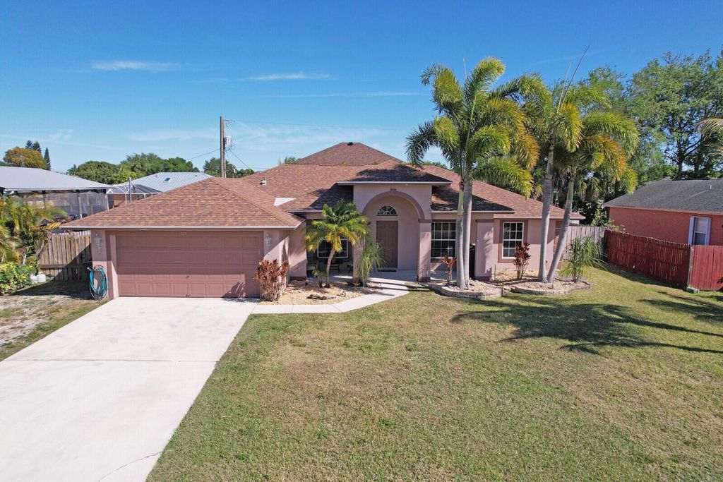 Photo of 571 SW Baoy Avenue, Port Saint Lucie, FL 34953 (MLS # R11086023)