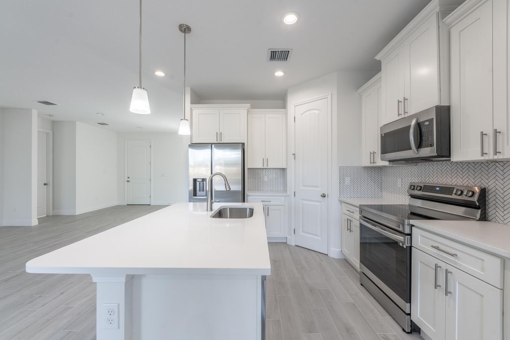 Photo of 532 SW Sansom Lane, Port Saint Lucie, FL 34953 (MLS # R10980247)