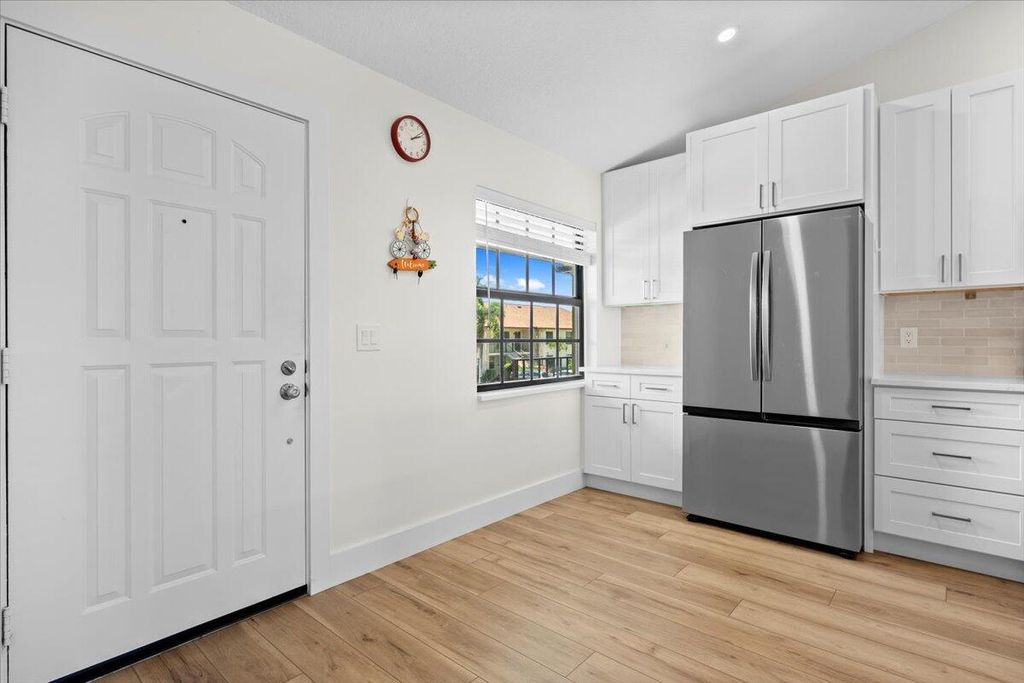 Photo of 302 Pinecrest Circle #D, Jupiter, FL 33458 (MLS # R11090332)