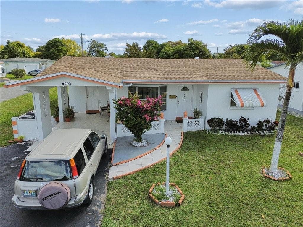 Photo of 4290 NW 49th Terrace NW, Lauderdale Lakes, FL 33319 (MLS # B26062200)