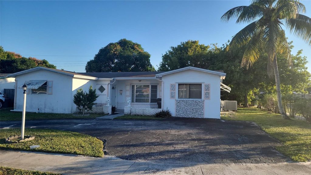Photo of 3390 NW 42nd St, Lauderdale Lakes, FL 33309 (MLS # F10542466)
