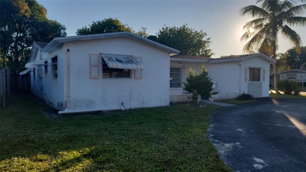 Photo of 3390 NW 42nd St, Lauderdale Lakes, FL 33309 (MLS # F10542466)