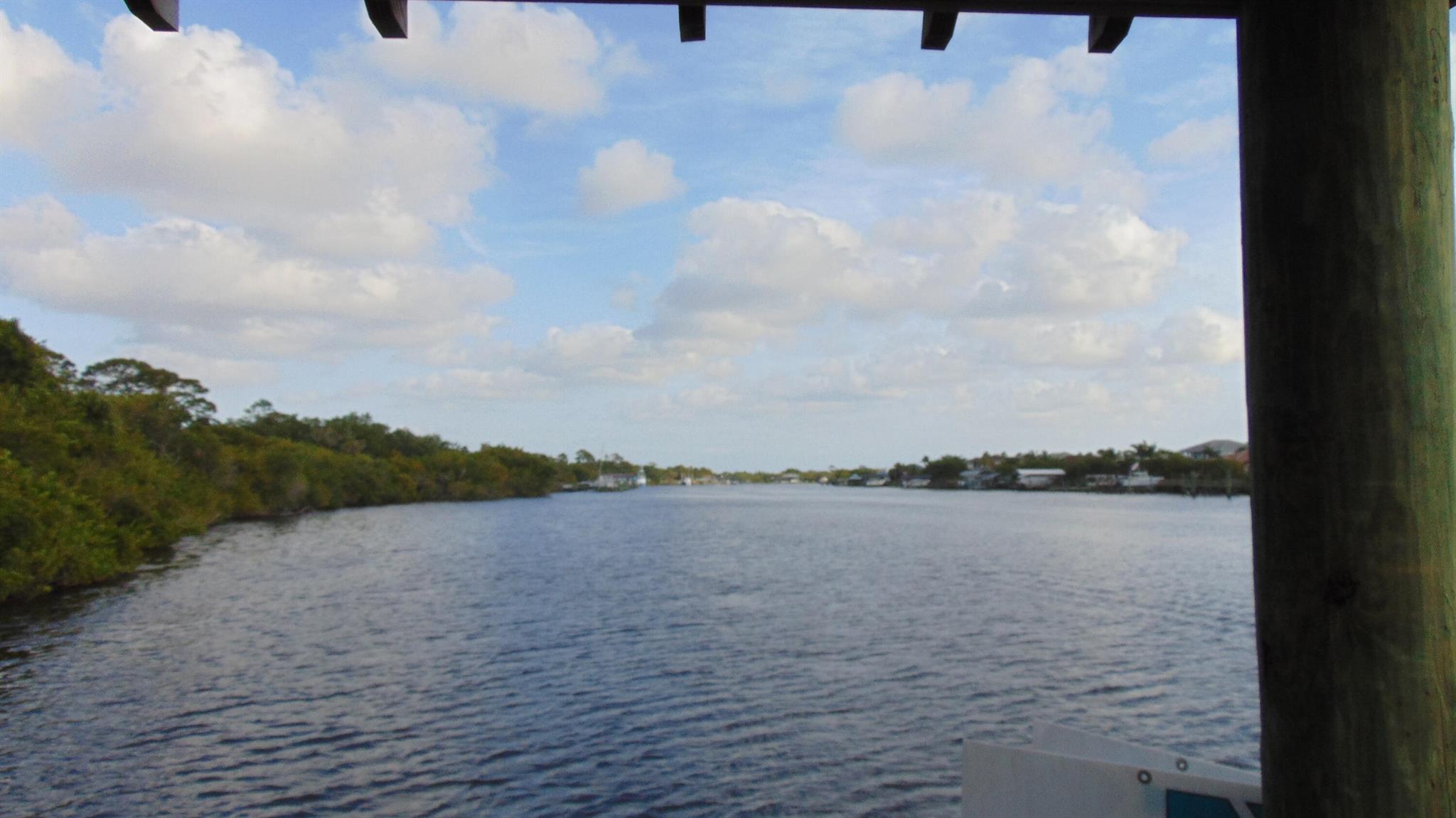 Exquisite waterfront estate in prestigious Vikings Lookout. extensively upgraded 4BR/3BA residence with 90'+ river frontage, private dock (10klb lift), and no fixed bridges. Chef's kitchen, luxe finishes, whole-house generator, and dual AC. Moments from Club Med. An exceptional opportunity. RV Boat parking with cover and electric.
