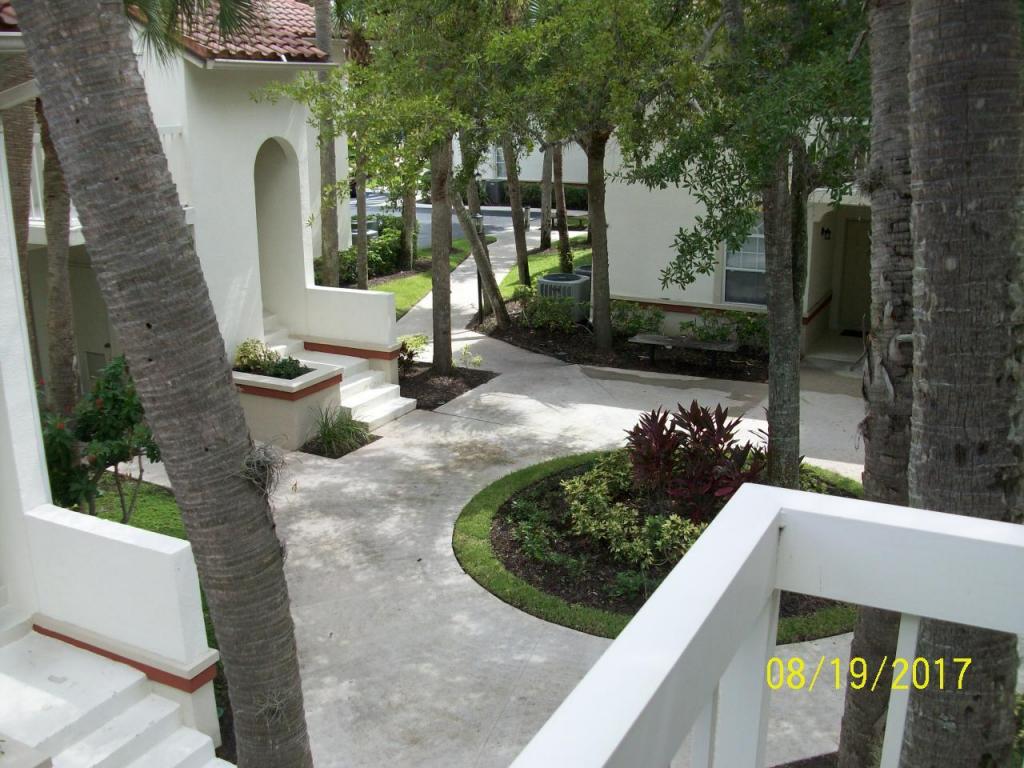2nd floor wide water views from covered and screened patio;Impact windows in both bedrooms and kitchen plus accordion porch shutters;engineered hardwood both bedroom floors - ceramic in living area.vaulted ceilings Extra storage closet by front door. Short walk to Community pool plus Golf,Spa,fitness facilities, restaurants and resort hotel amenities available all in the PGA gated community.pet negotiable.More painting,cleaning & upgrades in progress.