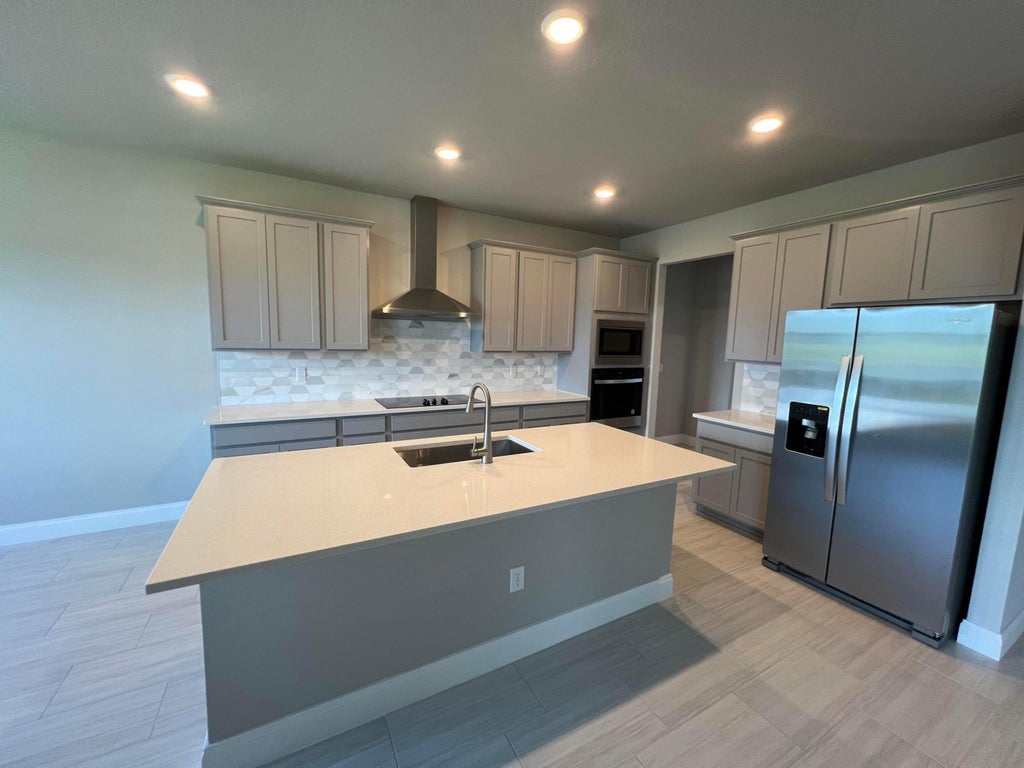 Photo of 6313 NW Cloverdale Avenue, Port Saint Lucie, FL 34987 (MLS # R11113456)