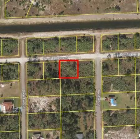 Discover the perfect canvas for your dream home on this spacious 0.25-acre lot, ideally situated in a tranquil neighborhood of Lehigh Acres. This parcel offers ample space for a custom-built residence with room for outdoor amenities. Enjoy the convenience of nearby schools, parks, and shopping centers, all within a short drive. With easy access to major roadways, commuting to surrounding areas is seamless. This lot provides a unique opportunity to create a personalized haven in a growing community.
