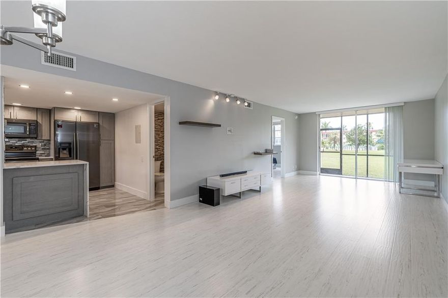 PHASE II - FIRST FLOOR 1BR/1.5 BA. FULLY UPDATED & RENOVATED! Stunning Kitchen w/ resistant SS appliances, quartz countertop including extra counter/storage space.  & decorative full tile backsplash,  Master Bath w/extensive quartz countertop, designer wall tile & frameless glass doors. Bedroom features wooden blinds, walk-in closet w/ extra shelving. 24 hr guard gated. FREE golf (except cart fees) on two 18 hole courses (PGA & Par3);Amenities include Restaurant, Billiard Room, Bbq/Picnic Area, Clubhouse-Clubroom, Common Laundry, Courtesy Bus, Exercise Room, Heated Pool, Library, Putting Green, Sauna, Shuffleboard, Tennis, Pickle Ball, Vehicle Wash Area. NO MEMBERSHIP EQUITY! Close to shopping, dining and highways. 15 minutes to the beach. BEAUTIFUL! UPDATED PLUS! CLEAN & MOVE-IN READY!