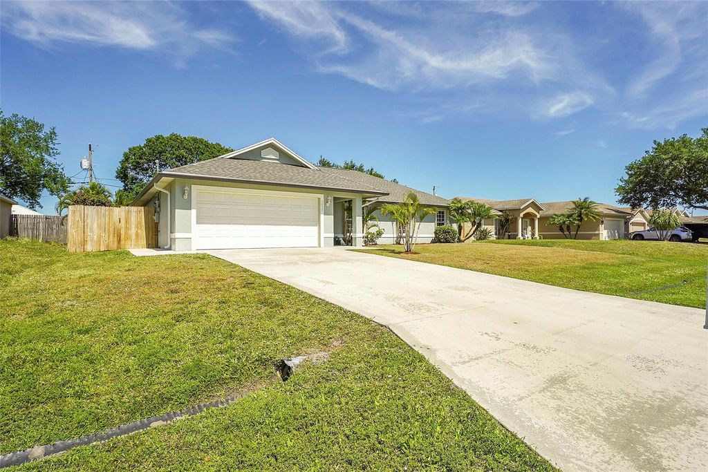 Photo of 1057 SW Locke Avenue, Port Saint Lucie, FL 34953 (MLS # F10430066)