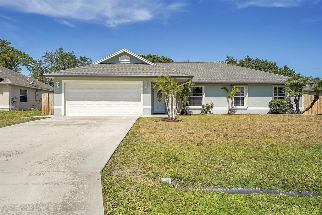 Photo of 1057 SW Locke Avenue, Port Saint Lucie, FL 34953 (MLS # F10430066)