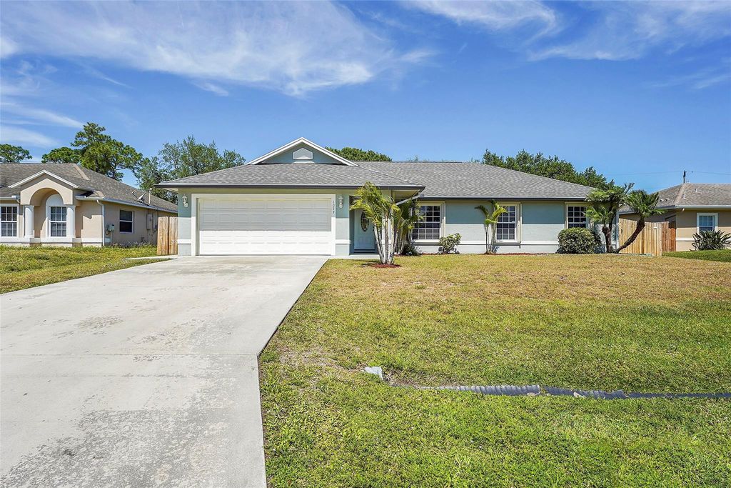 Photo of 1057 SW Locke Avenue, Port Saint Lucie, FL 34953 (MLS # F10430066)