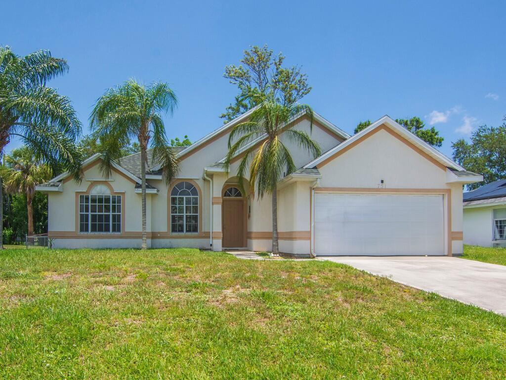 WELCOME HOME to this beautiful 3 bedroom, 2 bathroom, 2 car garage home in Port St. Lucie! This home features a split bedroom floor plan, fenced in backyard with fruit trees, and NO HOA! Schedule your private showing today!
