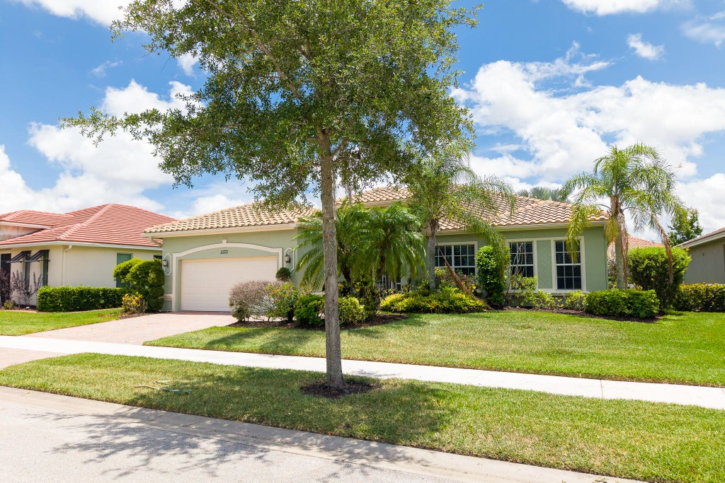 Photo of 11331 SW Aspen Lane, Port Saint Lucie, FL 34987 (MLS # B26040944)