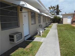 CORNER GARDEN STYLE FIRST FLOOR CONDO, TILE THROUGHOUT, 2 WINDOW A/C, NICE PATIO IN THE BACK, ASSIGNED PARKING, SMALL LAUNDRY FACILITIES, MINUTES TO SHOPPING AND HIGHWAY. VERY QUIET COMMUNITY!