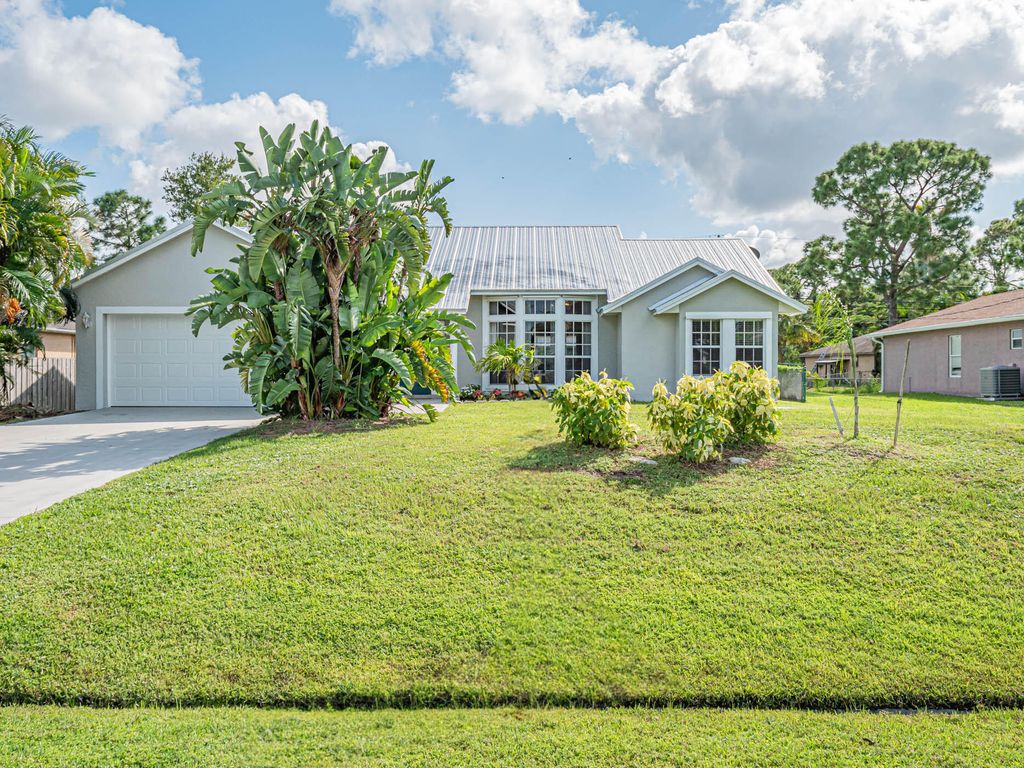 Photo of 1932 SW Delmonico Avenue, Port Saint Lucie, FL 34953 (MLS # R10914631)