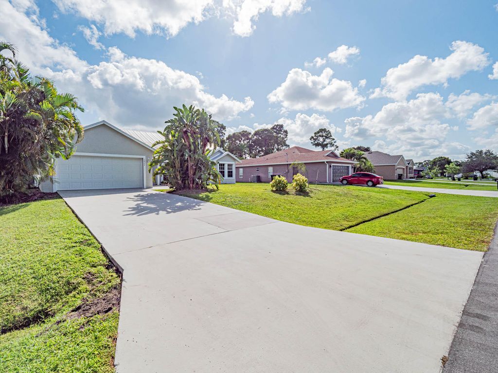 Photo of 1932 SW Delmonico Avenue, Port Saint Lucie, FL 34953 (MLS # R10914631)
