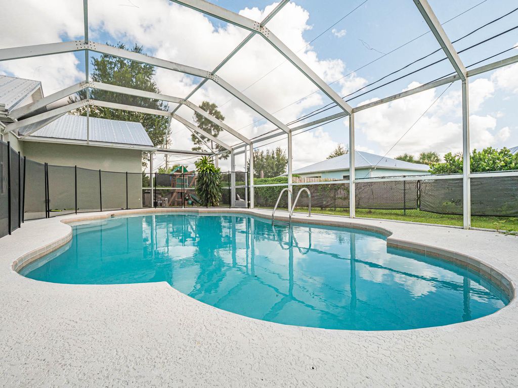 Photo of 1932 SW Delmonico Avenue, Port Saint Lucie, FL 34953 (MLS # R10914631)