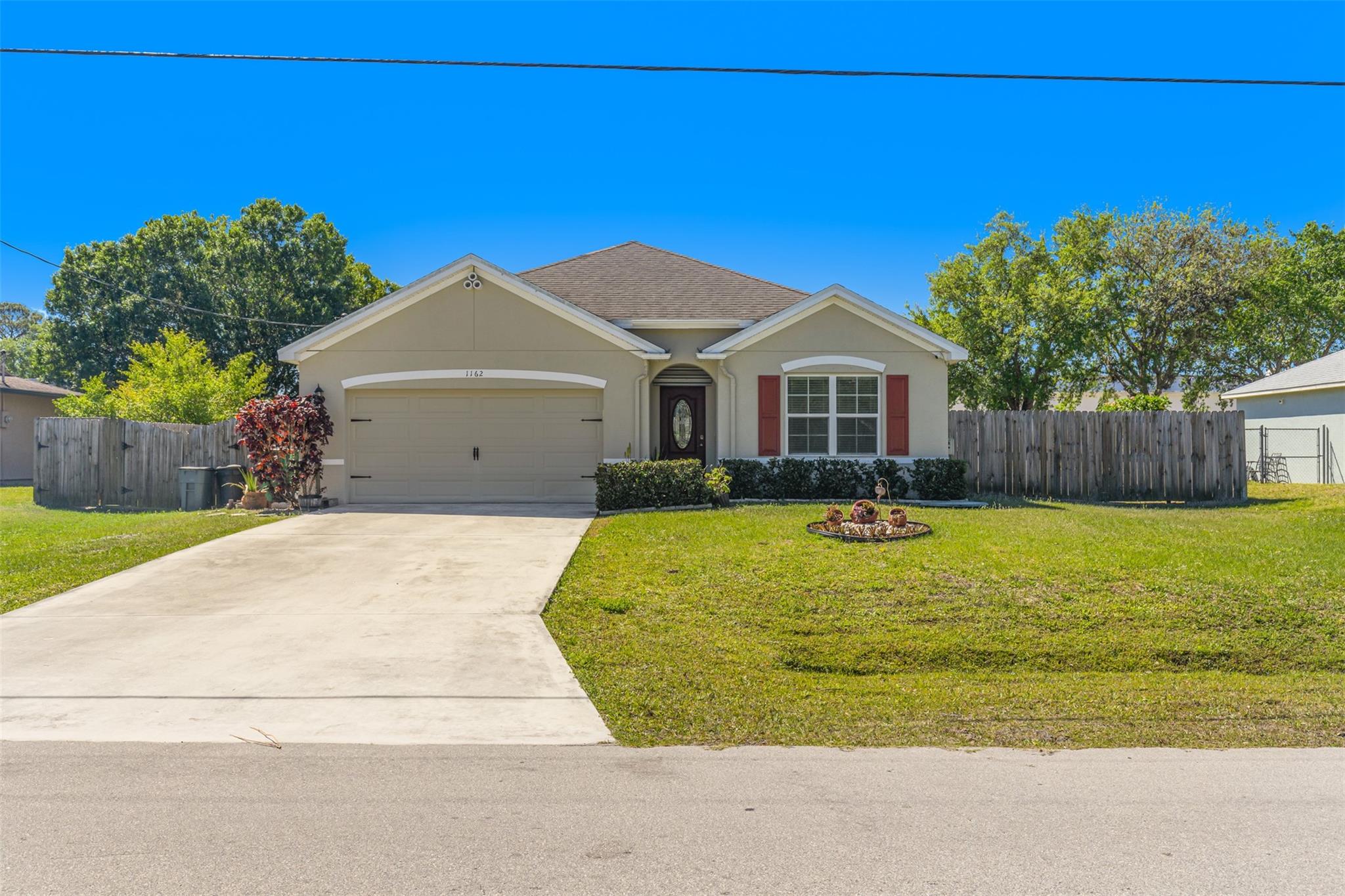 Meticulously maintained single family home located in a HOA free neighborhood. This newer construction property boasts, tile throughout, vaulted ceilings, very functional floorplan, 2 car garage, indoor laundry room, impact windows and doors, tons of closet space and large backyard with plenty of room for a pool if desired. Trisplit bedrooms makes this home ideal for a growing family. Freshly painted interior and very clean! Bring your belongings and move right into this beautiful home!