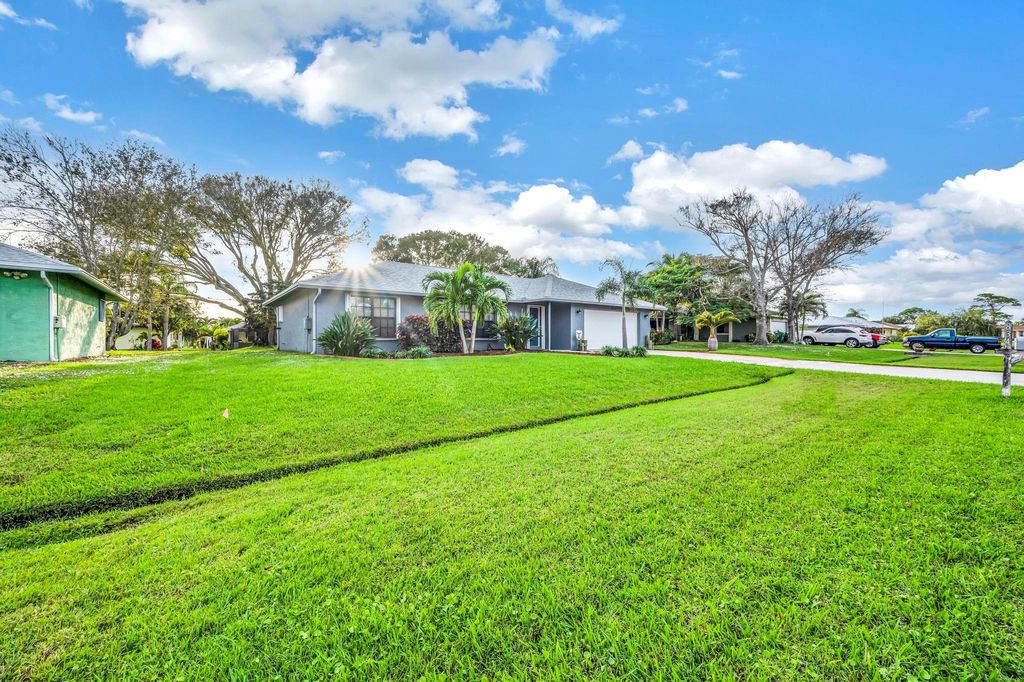 Photo of 834 SE Roulette Lane, Port Saint Lucie, FL 34983 (MLS # R10926798)