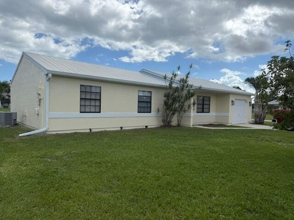 Photo of 1561 SE Arenson Lane, Port Saint Lucie, FL 34952 (MLS # R11135576)