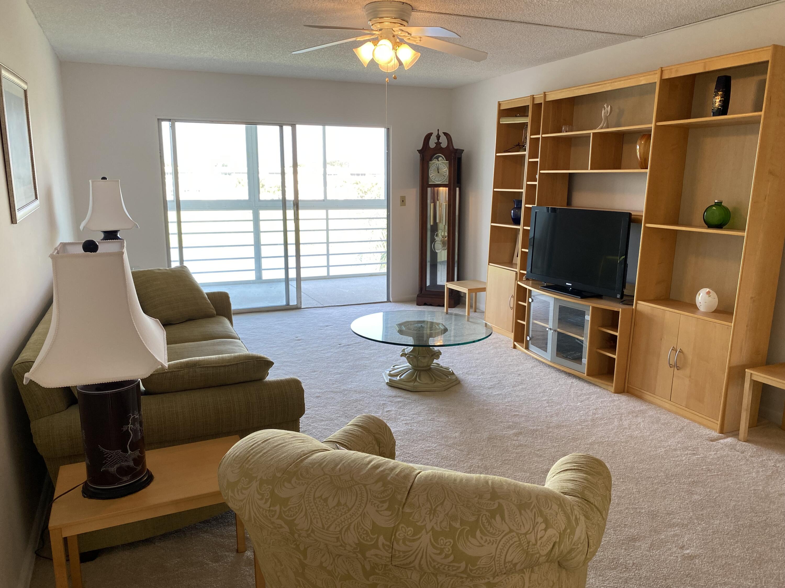 MOTIVATED SELLER. Bring your best offer! Bright and light 4th floor 2/2 unit in the scenic 55+ community of Wynmoor. Enjoy gorgeous sunsets over the lake and golf course from your breezy screened porch. Primary suite with walk-in closet and good sized second bedroom, tons of natural light, furniture optional. The condo is a top floor unit so no upstairs neighbor. Wynmoor is an active 55+ community with amenities such as a 50,000 sq. foot clubhouse, fitness center, theater,18-hole golf course, tennis/pickleball courts, 150+ clubs, and much more. Close to shopping, dining & Turnpike. Courtesy buses available!