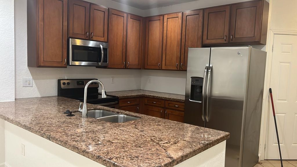 Photo of 4103 Napoli Lake Drive, Riviera Beach, FL 33410 (MLS # R10985714)