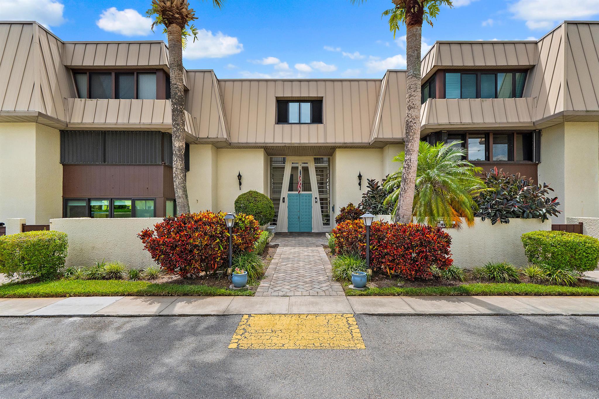 Highly desirable 1st-floor unit in Conquistador, a premier 55+ community in Stuart. This open-concept, split-bedroom layout offers comfort and privacy in a quiet setting. Enjoy resort-style amenities including a clubhouse, pools, dog park, fitness center, tennis, pickleball, ballroom, and library and more. Private community dock across the street provides access for kayaking and fishing. Just minutes to downtown Stuart's shops and dining, and less than a mile to the beach. Close to Cleveland Clinic and top medical specialists. Perfect for seasonal or year-round living!