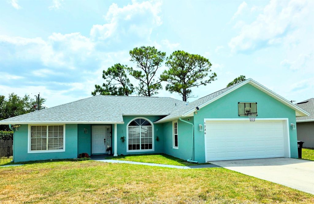 Photo of 1236 SE Manth Lane NE, Port Saint Lucie, FL 34983 (MLS # R11075933)