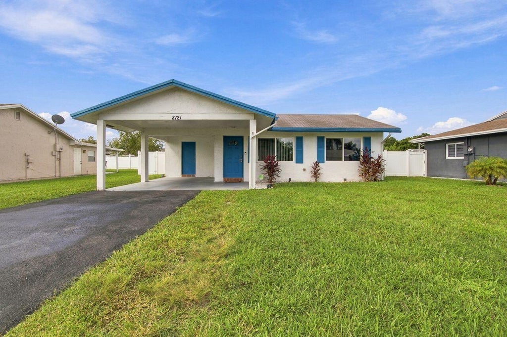 Photo of 8121 NW 93RD Avenue, Tamarac, FL 33321 (MLS # B26092992)