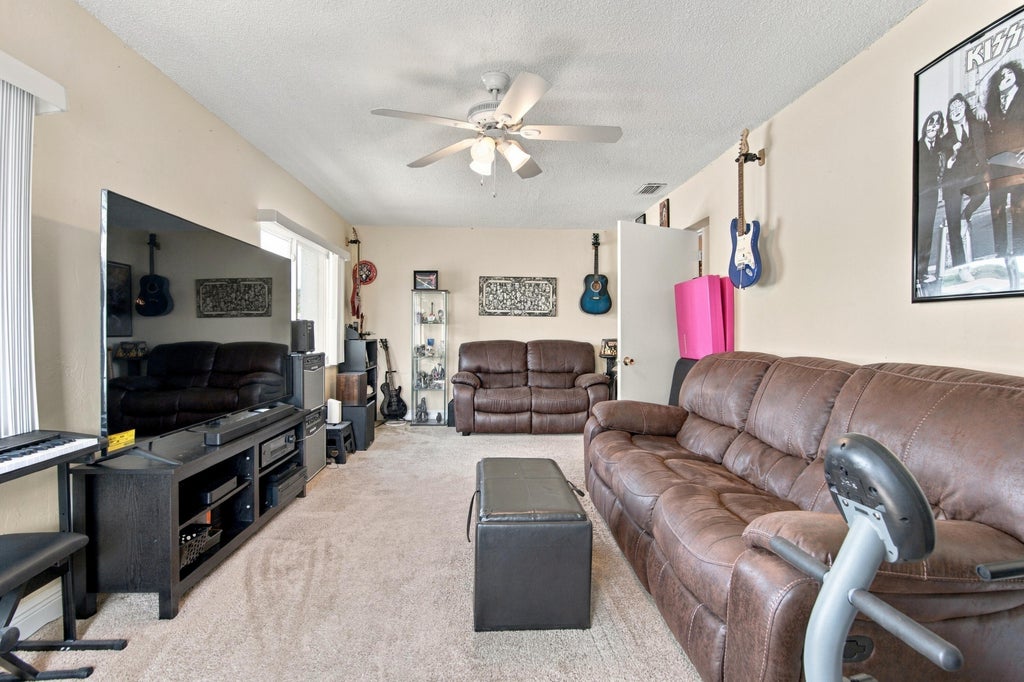 Photo of 8121 NW 93RD Avenue, Tamarac, FL 33321 (MLS # B26092992)