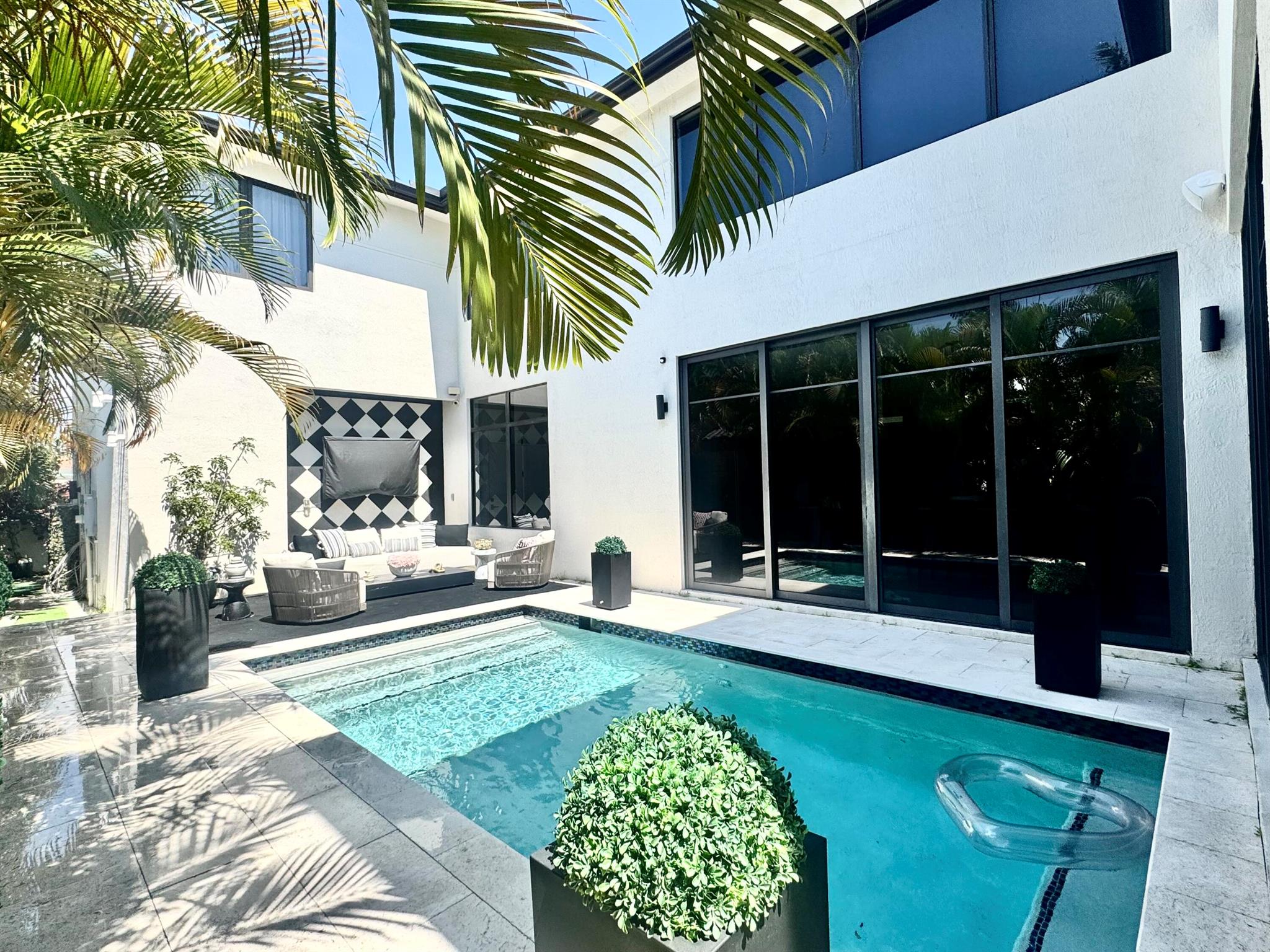 Now available for rent, this newer modern home in Victoria Park offers sleek design and smart living across two luxurious stories. The great room features 20-foot ceilings and floor-to-ceiling impact windows that flood the space with light. Enjoy an open layout with a chef-style kitchen, custom cabinetry, and a large island overlooking the family room, patio, and pool. Solid 8-foot doors, a metal roof, and a 2-car garage with lift-ready space add function. Fully automated smart home with control over lighting, audio, climate, and security. Walk to parks, dining, and shops. Minutes from Las Olas, downtown, Brightline, and the airport.