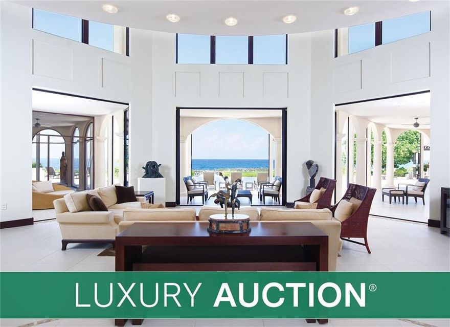Once asking $11.5 million... Now Selling via LUXURY AUCTION Without Reserve Oct 7!! This custom-built estate on Grand Cayman sits on a rare, oversized parcel boasting +2.3 oceanfront acres and panoramic views of the glistening Caribbean Sea. Living spaces include a luxe, 2-story main residence, separate guesthouse and caretaker’s cottage, which collectively offer 9 beds and 7.5 baths. Notable features include a grand salon with soaring ceilings, chef's kitchen, and sprawling outdoor living areas with an infinity-edge pool, spa, barbeque and expansive pool deck - all surrounded by tropical landscaping. Gated and exceptionally private, yet located just minutes from the capital of George Town, allowing for the ideal balance of luxury island living and modern convenience! Brokers welcomed. Cayman Islands broker of record: RE/MAX Cayman Islands. Agents Kim Lund and Cindy Raymond. For info, call 800 number in Broker Remarks.