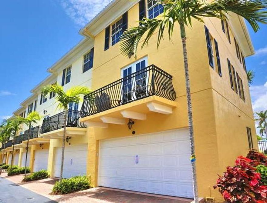 LOCATION...LOCATION...LOCATION! This townhome community is located near downtown Lake Worth and close to City Place, PBI Airport, beaches and 5 mins to I-95. This is a spacious end unit with 3 bedroom, 3 1/2 bath with a 2 car garage in an intimate enclave of homes. This home comes with IMPACT GLASS WINDOWS. Located on the 1st floor is a private bedroom and an en-suite bath with 1 other bedroom, bathroom and master suite with an en-suite bathroom on the 3rd floor. The master suite features his & her closets, dual sinks and a separate shower and tub.The 2nd floor features a great room w/balcony leading to outside, dining room, a kitchen with 42'' wood cabinets, granite counter tops and Frigidaire Gallery SS appliances. This home boasts real hardwood floors throughout & tile on the 1st floor. New front loading washer & dryer. A/C was replaced in 2014. Buildings exterior has been freshly painted. Within walking distance is Spillway Park located directly behind the community which has it's own fishing dock. HOA includes Common Areas, Insurance of the building and reserve funds.