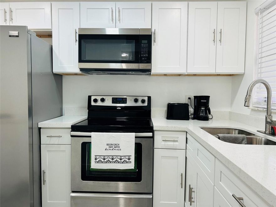 Very beautiful 2 bedroom 2 bathroom condo completely updated, featuring brand-new kitchen cabinets, appliances, and flooring throughout the entire unit. The bathrooms shine with new vanities, toilets, faucets, and shower fixtures. This corner unit has been refreshed with new light fixtures, door handles, new plumbing, and ceiling fans. The electrical system has been updated with new receptacles, and the walls have a fresh texture and paint. Additionally, a new thermostat ensures comfort and efficiency. Easy to show.