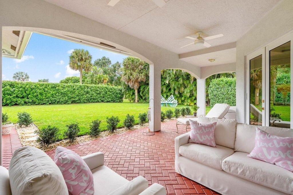 Photo of 100 N Country Club Boulevard, Atlantis, FL 33462 (MLS # R10963306)