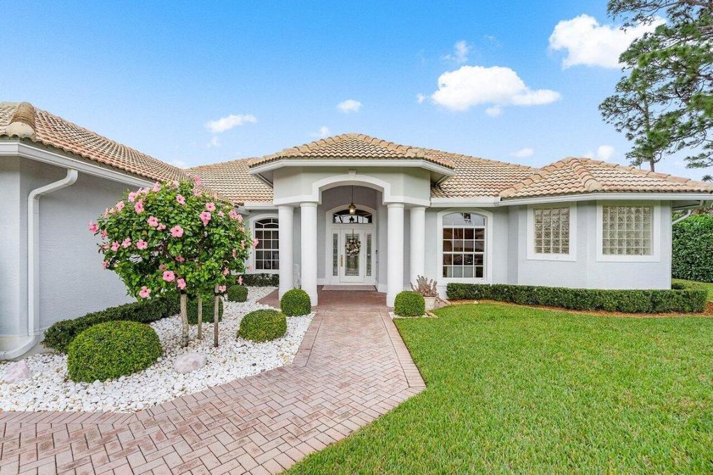 Photo of 100 N Country Club Boulevard, Atlantis, FL 33462 (MLS # R10963306)