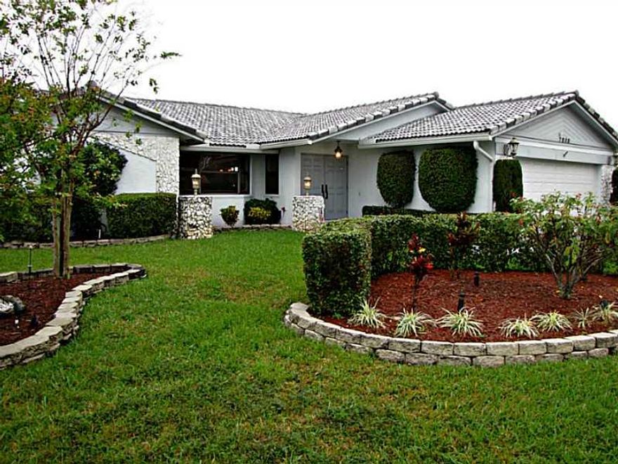 Updated 4 bedroom, 2 bath home in Sunflower Margate! **2010 Roof **Kitchen features wood cabinets, granite counters & wine fridge ** Open great room with vaulted ceiling, tile floors & convenient in floor electricity ** Master bath has updated tile & new  vanity ** Tile floors throughout living area & wood laminate in the bedrooms ** Split bedroom plan ** Screened patio ** Fenced yard ** Gorgeous landscaping ** Water purification system for the entire house ** Great neighborhood with a terrific park **