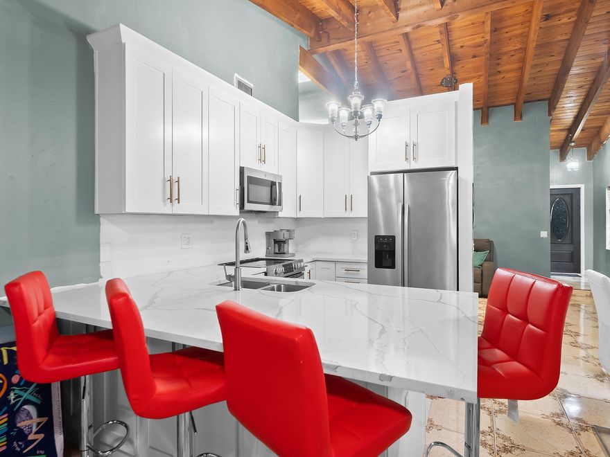 New Kitchen, new bathrooms, new roof - just move in! Discover this beautifully renovated corner-lot townhouse with 3 bedrooms and 2 bathrooms, nestled in the Brentwood Manors community with low HOA fees! This charming home offers over 1,500 square feet of modern living. An open-concept design features a welcoming living room, a stylish kitchen with quartz countertops, new stainless steel appliances, and a spacious dining area perfect for entertaining. The primary bedroom includes a walk-in closet and a lovely new bathroom, with an additional updated hall bath. Natural light fills the living area of the home through the new skylight, and recent upgrades, such as a new roof, add an extra sense of peace of mind. Fenced backyard—an ideal spot for relaxing or hosting outdoor gatherings.