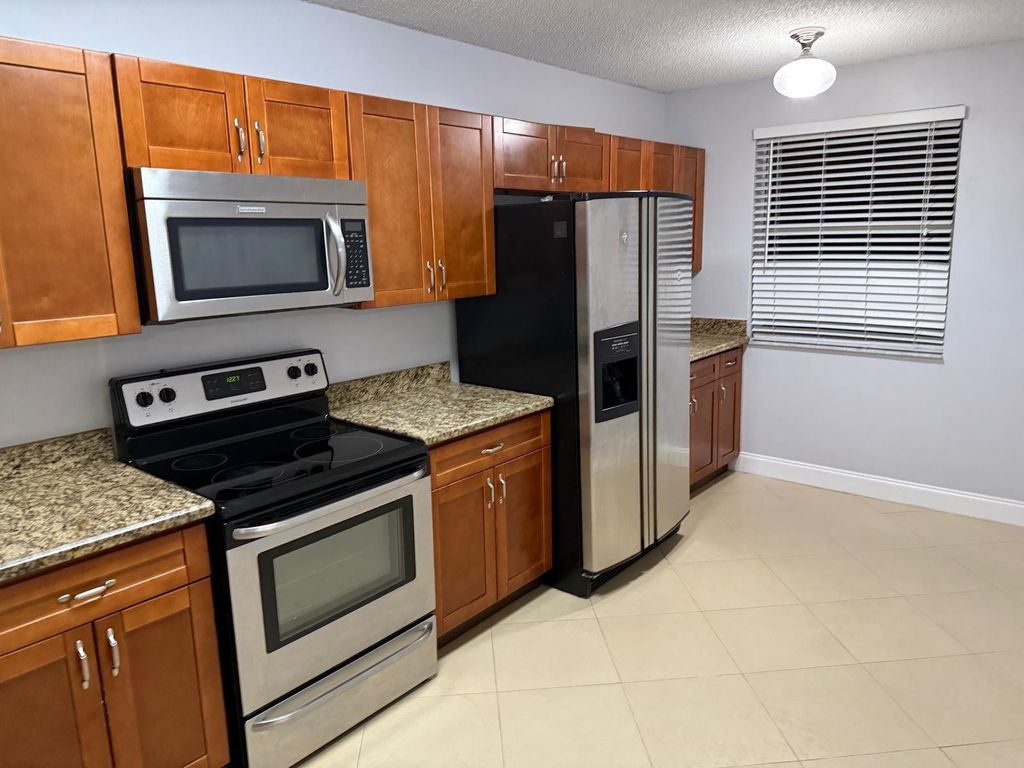 Photo of 8741 Wiles Road #302, Coral Springs, FL 33067 (MLS # F10490235)