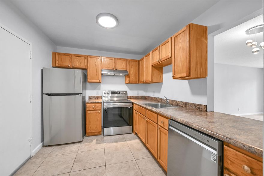 Step Inside to Spacious Comfort in Plantation. The kitchen features LG appliances, ample cabinetry, and a second exit door for convenience. The open living and dining area flows to a screened patio—perfect for morning coffee. Natural light pours through the sliding doors, creating a warm, welcoming vibe. The master suite offers a walk-in closet, updated vanity, and private shower—all with views of the canal and tree-lined parking. Two additional bedrooms add flexibility for family, guests, or a home office. In-unit washer/dryer hookup, Goodman AC, Rheem water heater, updated baths, and generous storage complete the home.
Whether you’re buying your first home or downsizing to simplicity, this condo is ready to become the lifestyle you’ve been searching for.