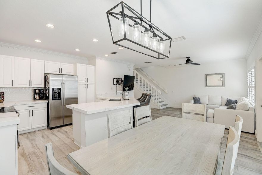 Introducing this gorgeous, bright, and airy 3-bedroom, 2.5-bath townhome, just under 2000 square feet, nestled in the highly sought-after Grand Cypress! This spacious townhome, is privately tucked away, boasts recent interior paint and a fully modernized open-concept kitchen featuring stunning Calacatta Quartz countertops and sleek Stainless Steel appliances.  Luxury vinyl flooring throughout this home, creating a contemporary and welcoming atmosphere.  With quick access to the Sawgrass Expressway and the Turnpike, commuting is a breeze. Townhome offers a private  backyard, ideal for entertaining and relaxation. Just steps away from community pool and a short drive to the beach! Make this your dream home!