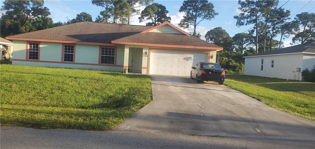 Photo of 1318 SW Kapok Ave, Port Saint Lucie, FL 34953 (MLS # F10303042)