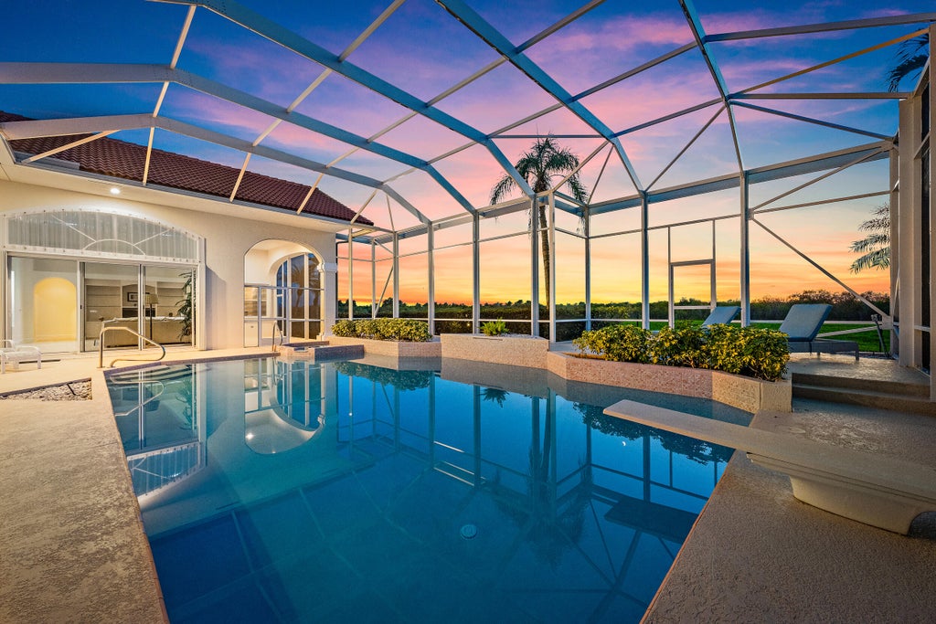 Photo of 64 Cayman Place, Palm Beach Gardens, FL 33418 (MLS # B26077019)